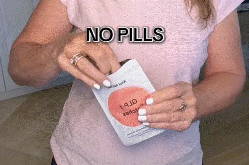 Woman applying patch on stomach